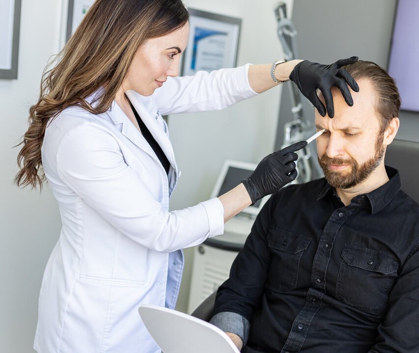 Nurse Jacklyn with a male client seeking mens aesthetic treatments