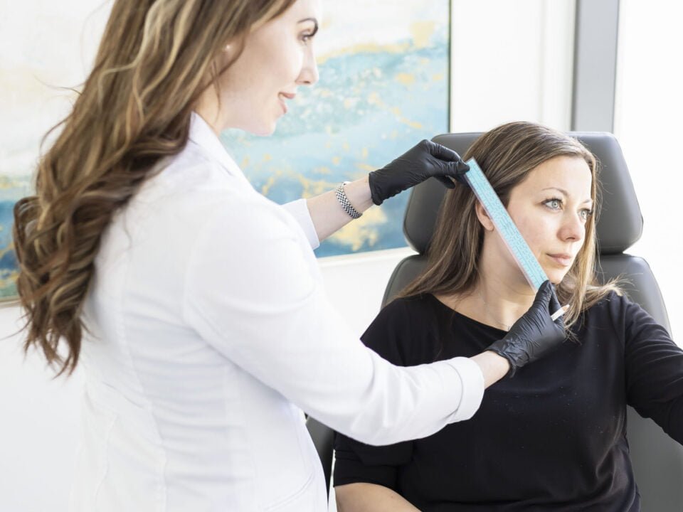 Nurse Jacklyn with a client getting ready for an Instalift procedure in a consultation