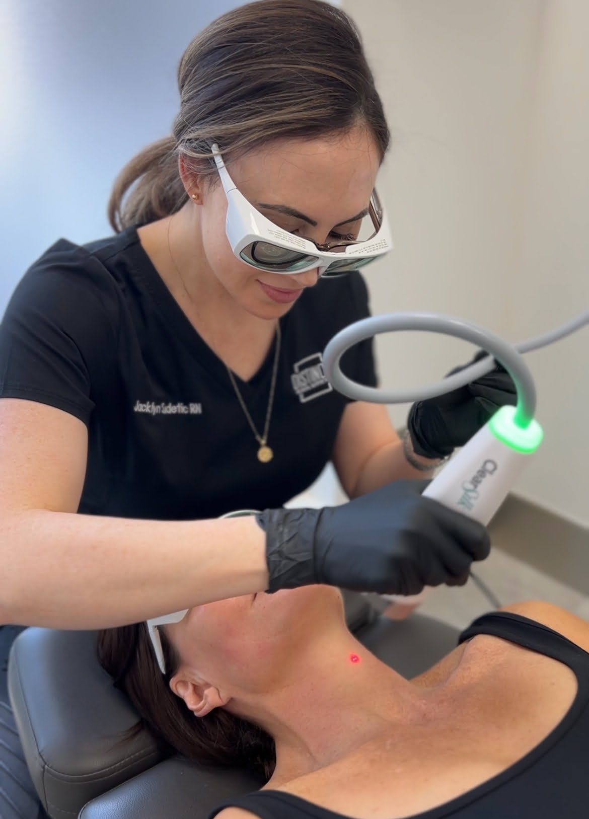 Nurse Jacklyn performing a Sciton ClearSilk treatment on the neck