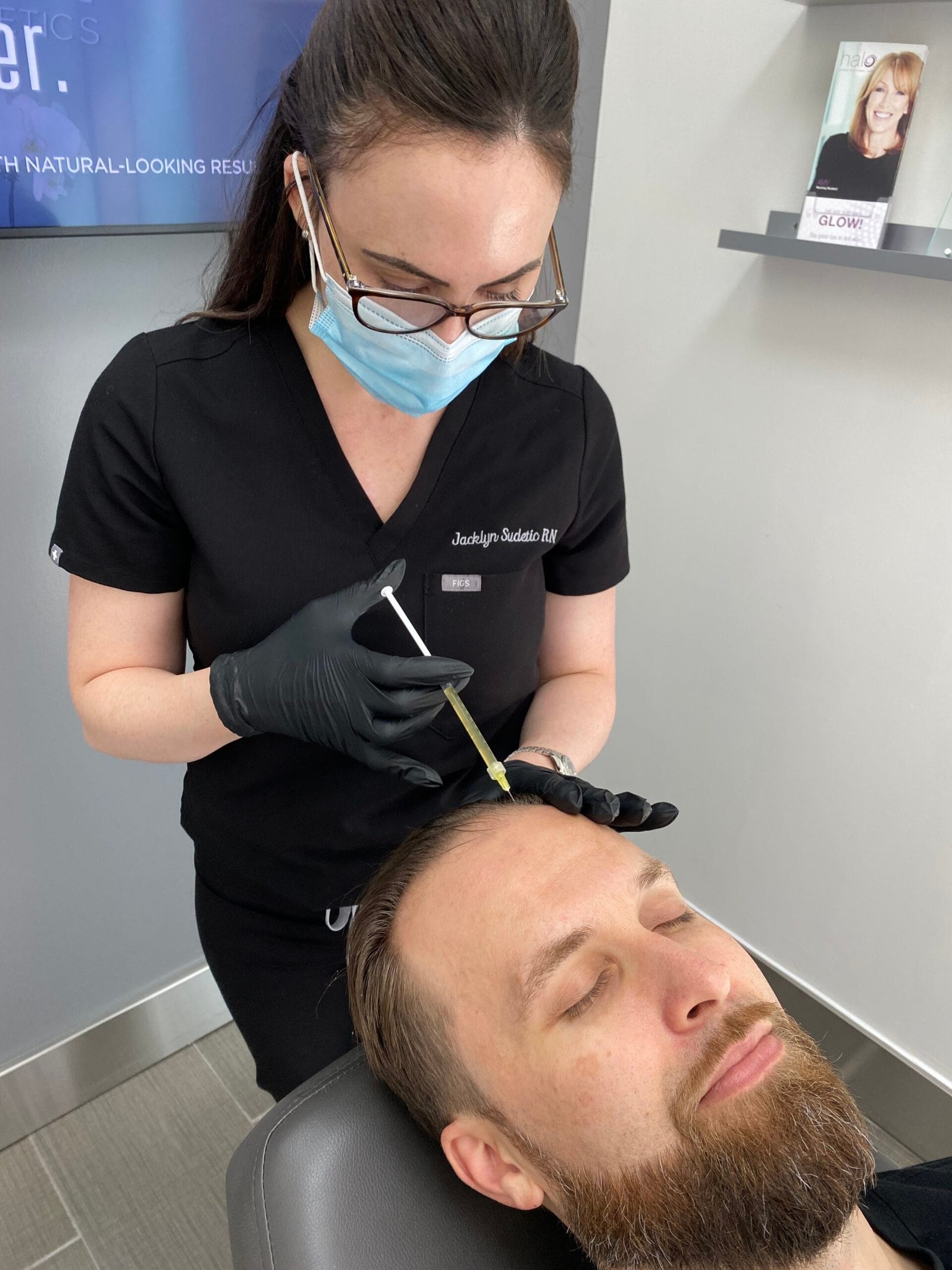 Nurse Jacklyn a PRF treatment on a male patient for hair restoration