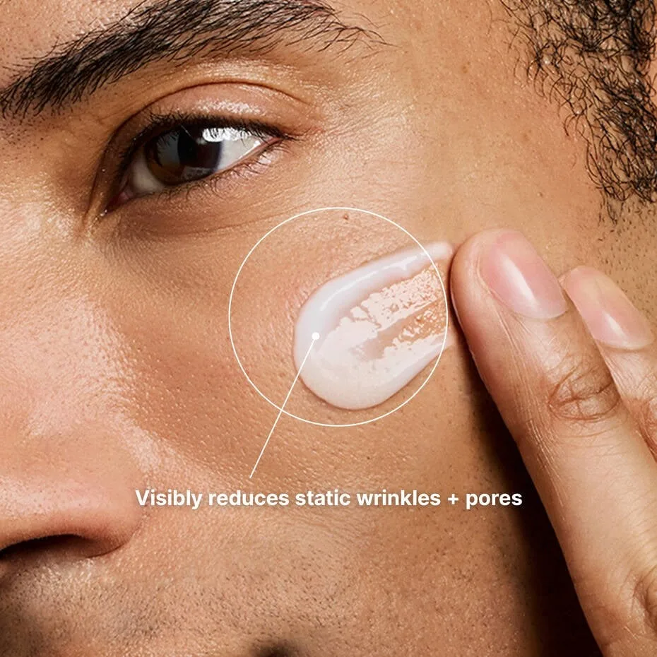 Model applying SkinCeuticals P-TIOX Anti-Wrinkle Cream to visibly target wrinkles and pores