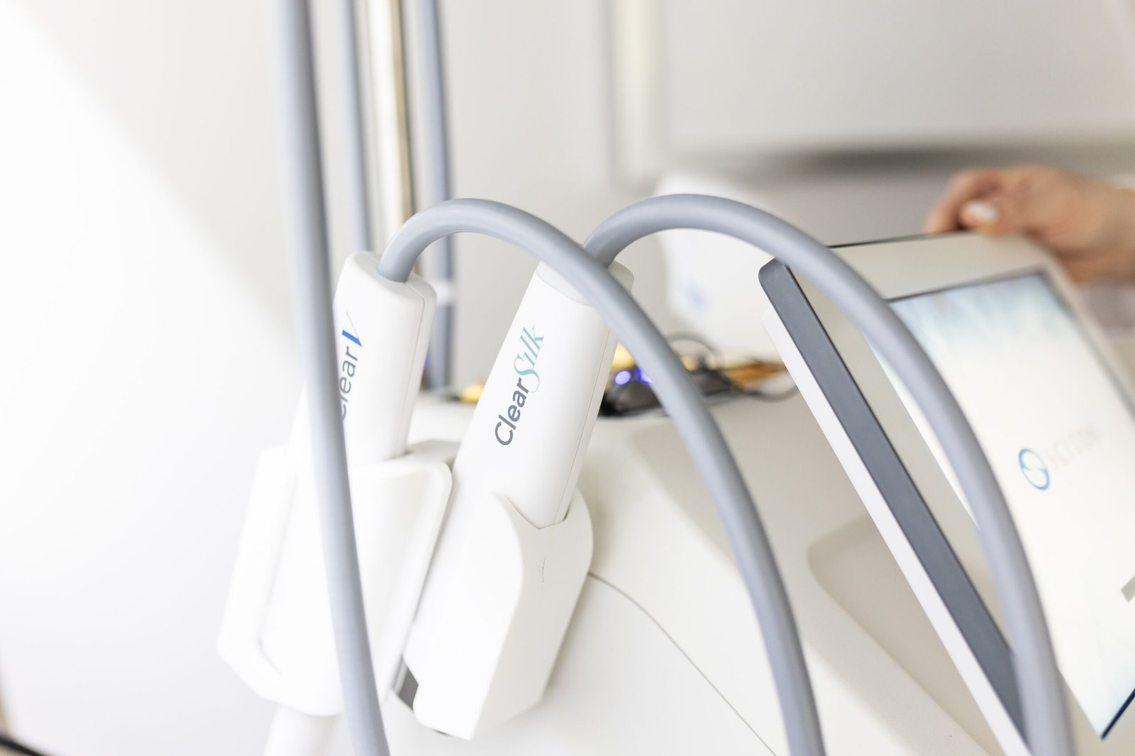 ClearSilk laser handpieces resting on the treatment device