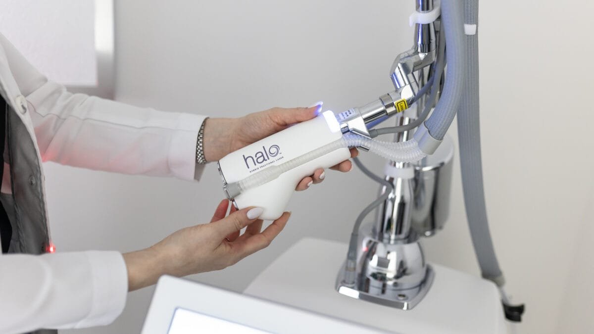 Practitioner holding the HALO hybrid fractional laser handpiece