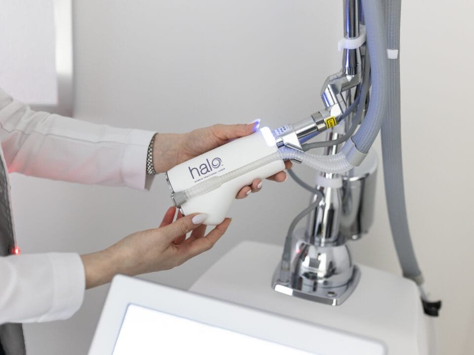 Practitioner holding the HALO hybrid fractional laser handpiece